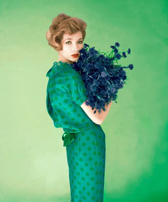 #31 Jessica Ford in a blue silk dress with green polka dots by Dan Keller, 1958.