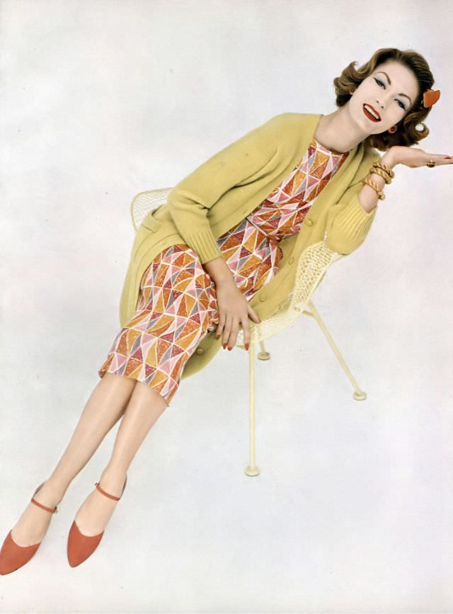 #33 Mary McLaughlin in a colorful diamond print dress with a lime-colored sweater coat, both by Greta Plattry, 1958.