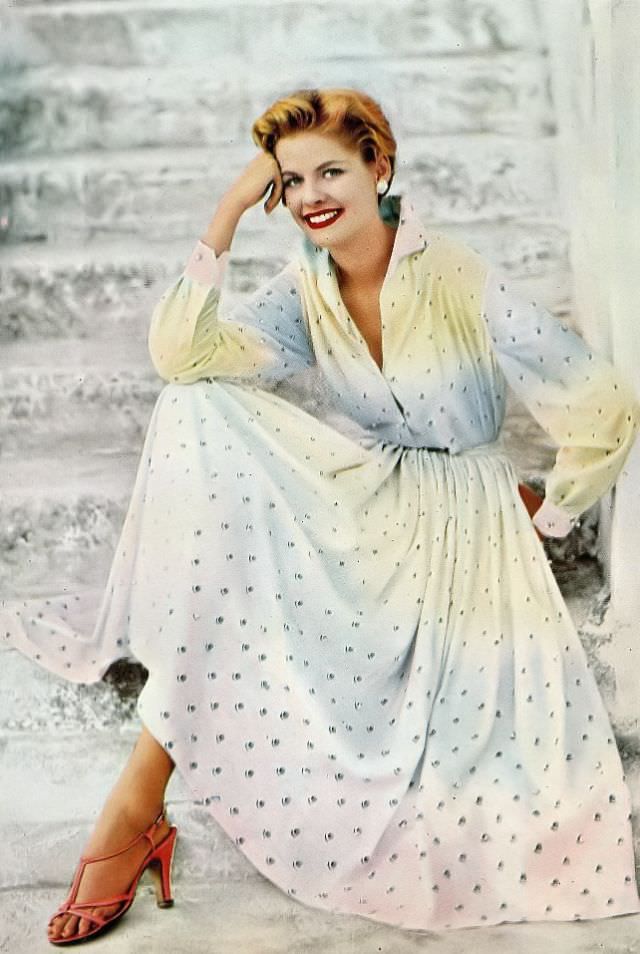 #4 Model dons a full-skirted shirtwaist dress in ombre cotton embroidered with pearls by Emilio Pucci, 1954.