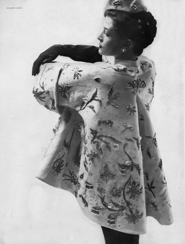 #2 Maxime de la Falaise wearing a white linen evening jacket intricately embroidered in silver and steel by Christian Dior, 1948.