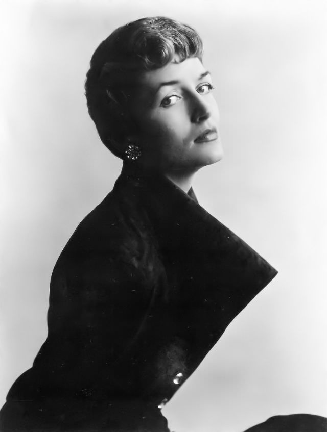 #3 Maxime de la Falaise in a coat by Schiaparelli with Napoleonesque hairstyle by Guillaume, 1948.