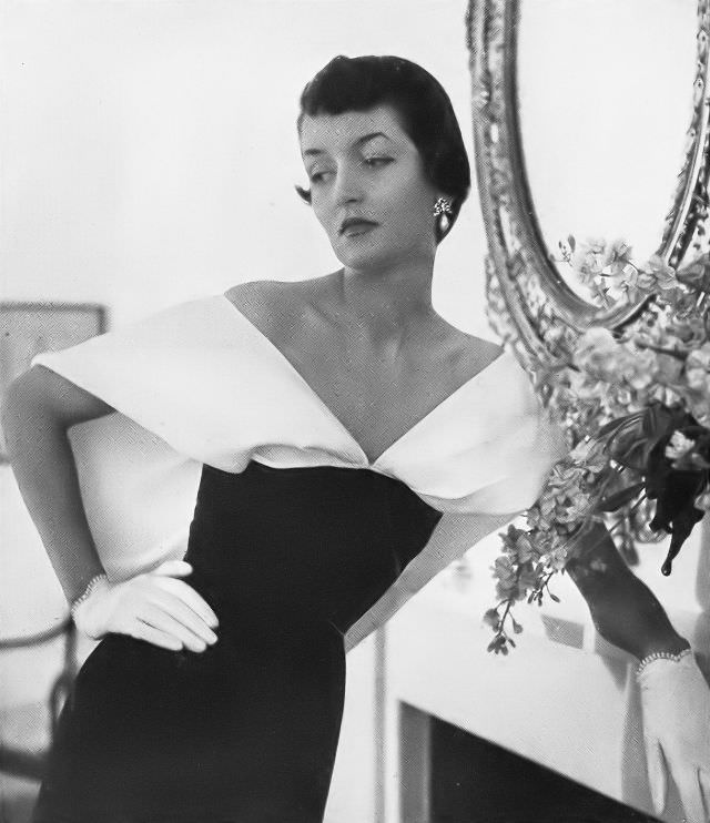 #7 Maxime de la Falaise in a black dinner dress with a large white linen collar by Schiaparelli, 1949.