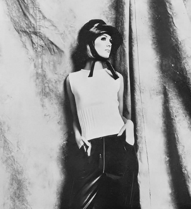 #18 Nicole de la Marge in White Shetland Wool Sweater and Aqua-Sprite Trousers, 1965