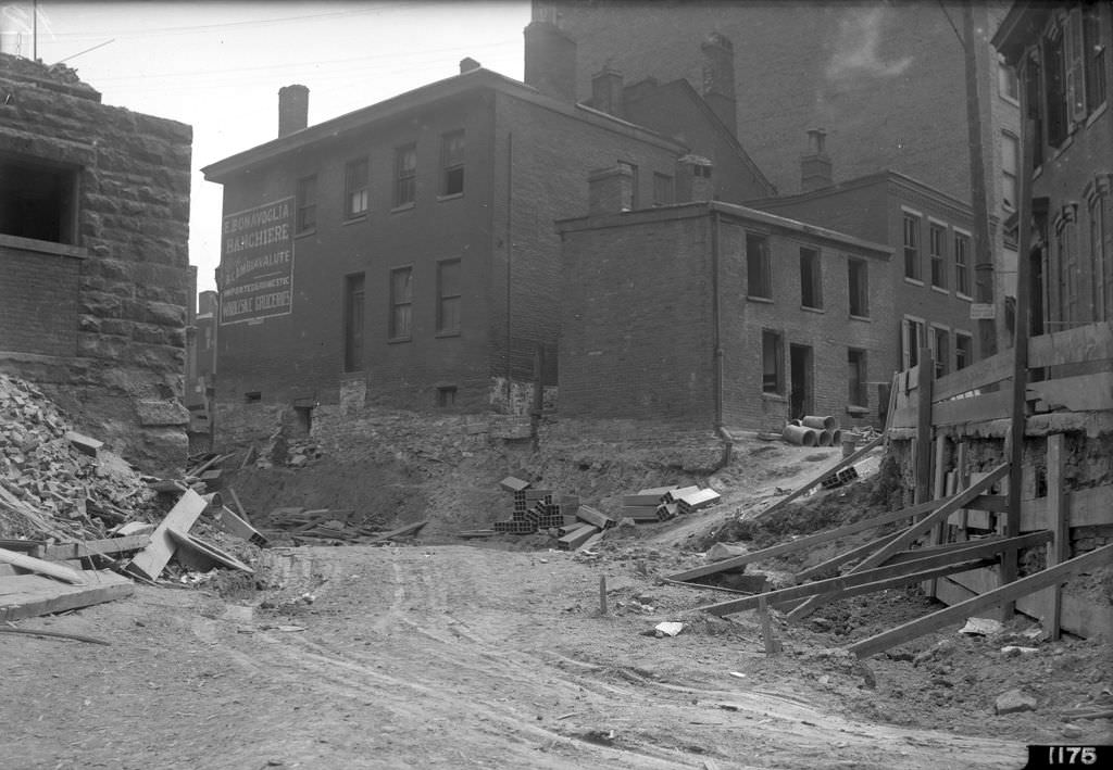 #75 Dante and Webster, corner in Hump District during “hump” cut project, 1912