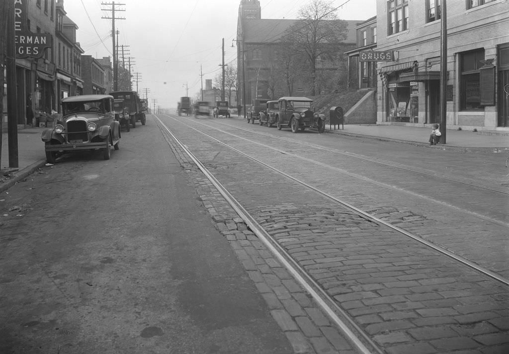 #79 Brownsville Road in Carrick with drug store and boy on curb, 1927.