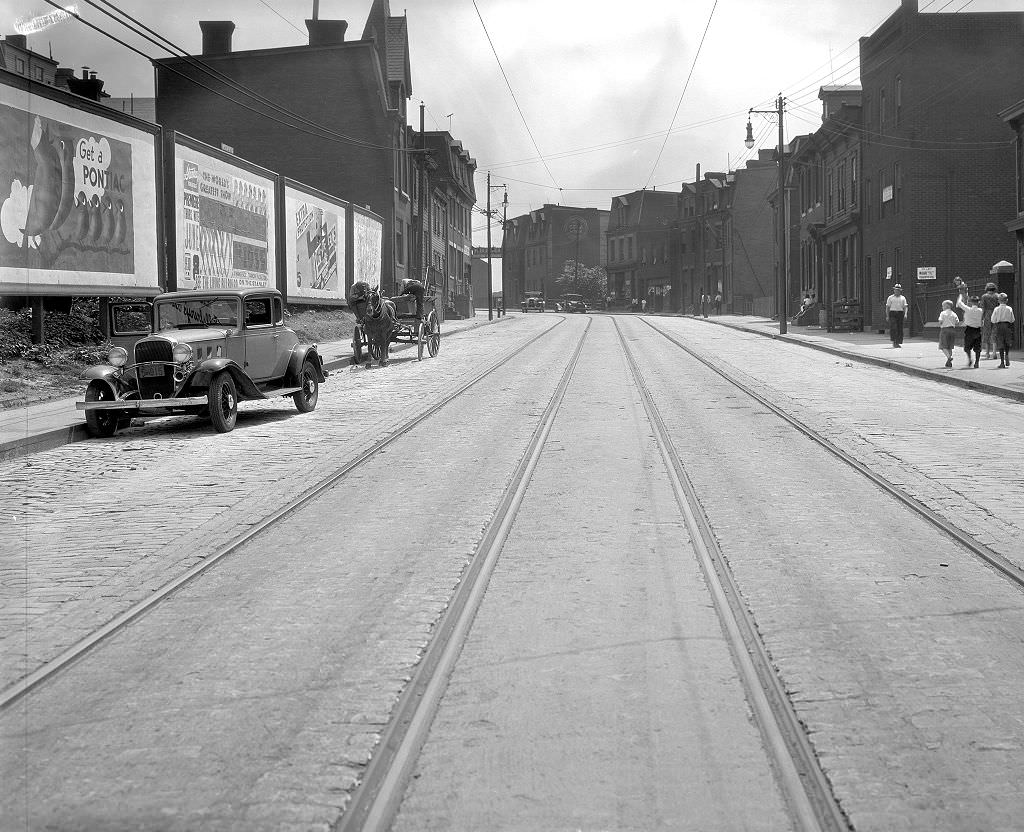 #63 Fifth Avenue scene featuring advertisements and a horse-drawn vehicle, 1933