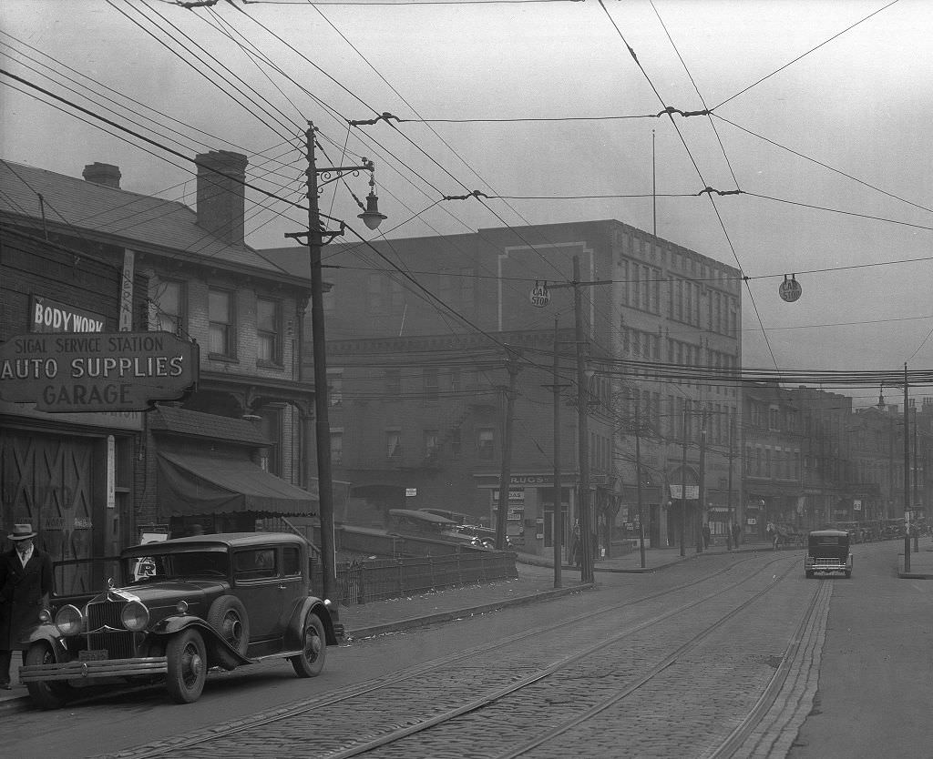 #81 Businesses at the intersection of Center Avenue and Devilliers Street, 1933