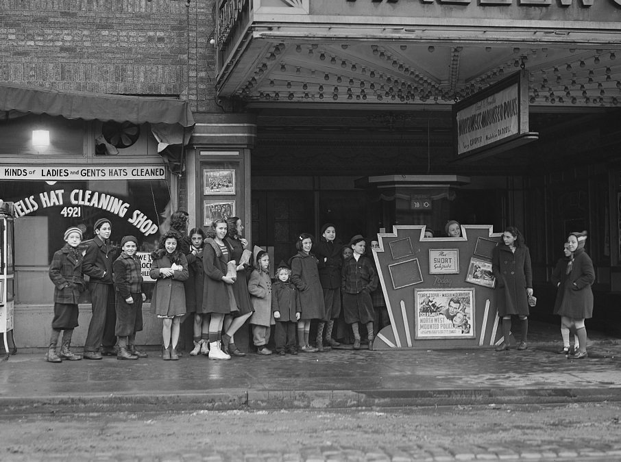 #106 Children at a Sunday movie house, 1941.