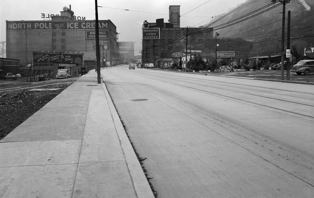 #24 West Carson Street looking east from opposite McFarlins Grill near the Duquesne Incline showing North Pole Ice Cream Company and Breakfast Cheer Coffee, 1940