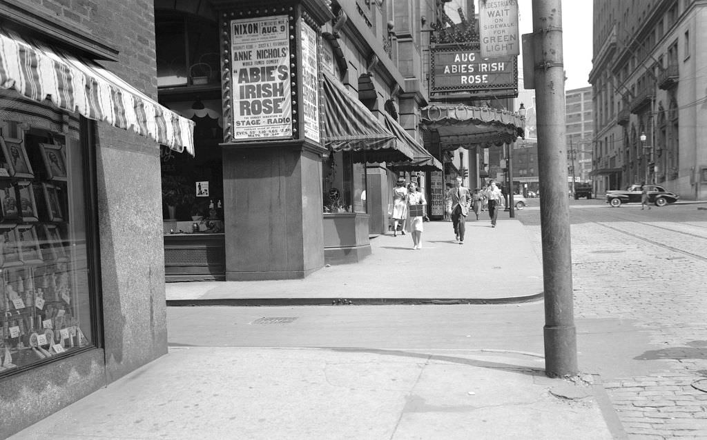 #77 View of Nixon Theatre on Sixth Avenue and Montour Way looking east, 1943.