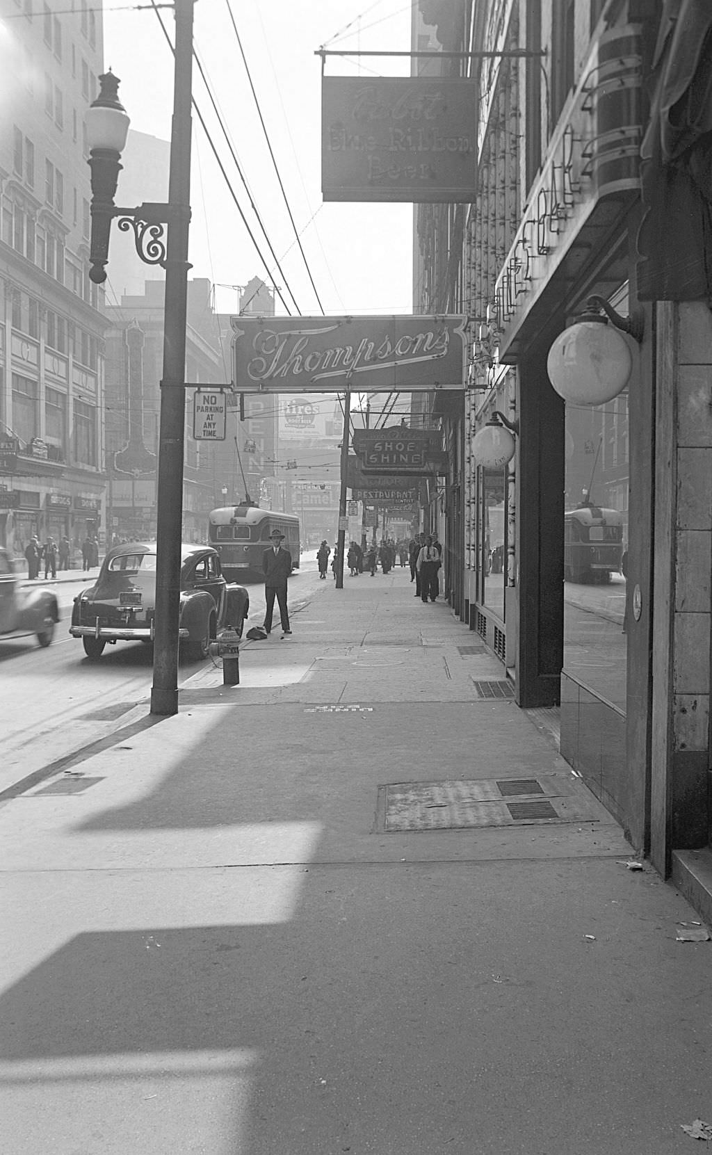 #84 View of Thompson’s Store and Dines Bar on Sixth Street, 1945.