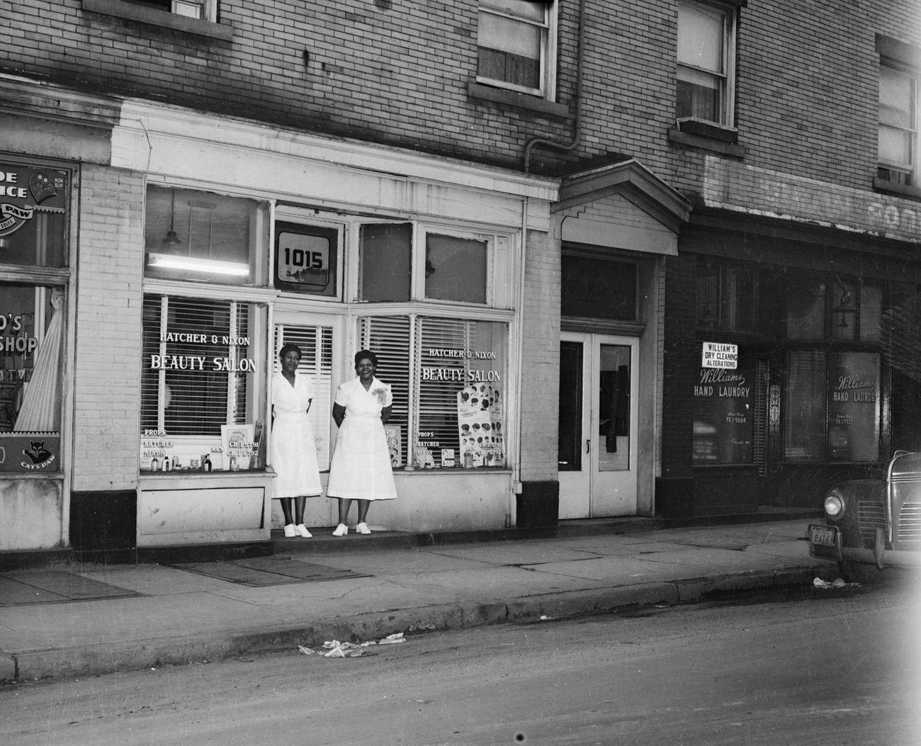 #22 Two Women Pose Outside Hatcher & Nixon Beauty Salon, Homewood, 1951