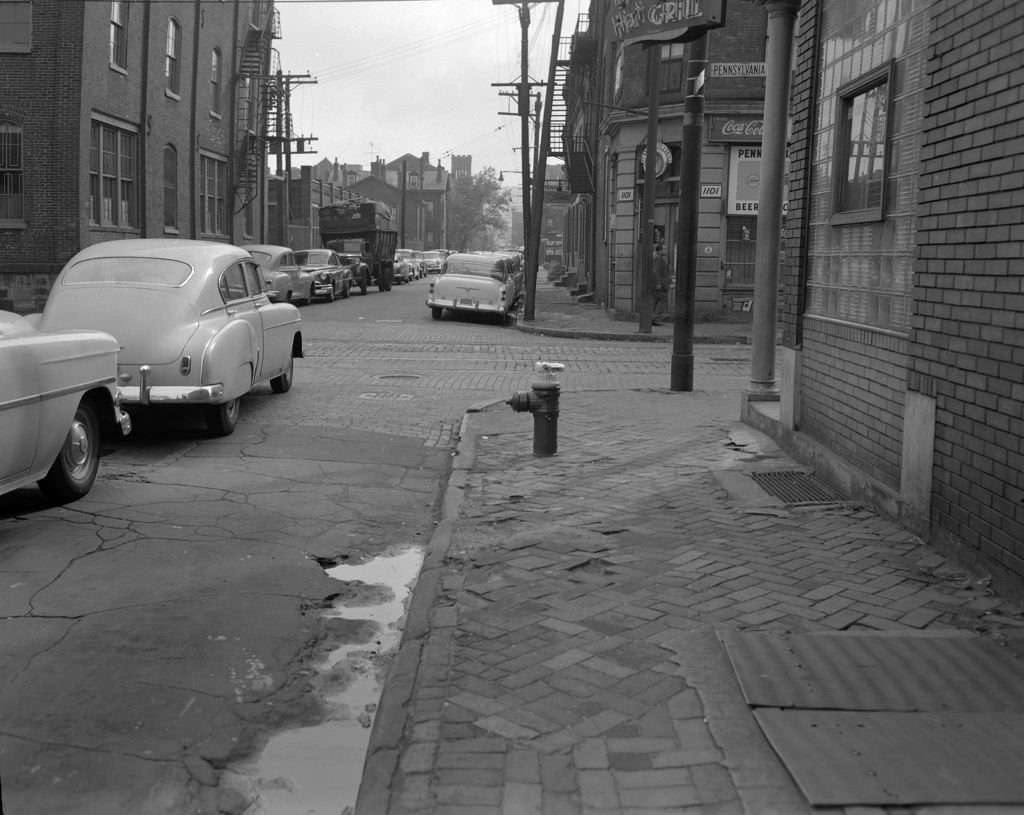 #111 Properties along Bidwell Street at the intersection with Pennsylvania Avenue, 1956