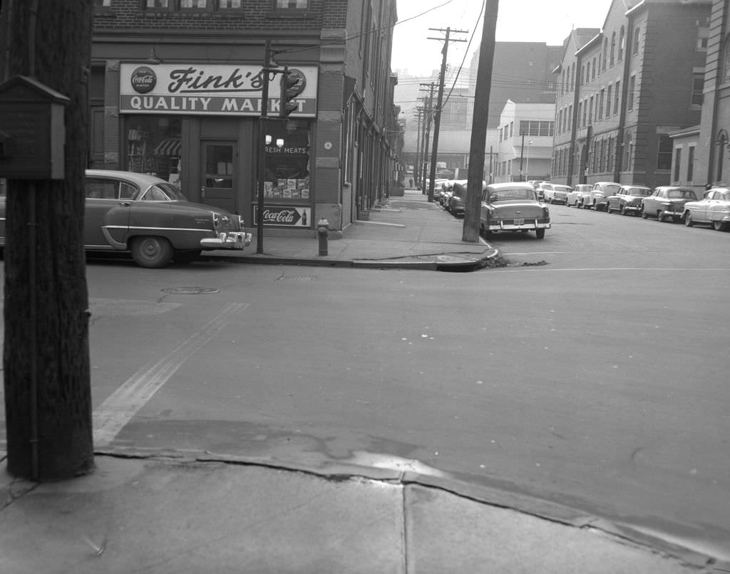 #117 South 22nd Street at the intersection with Sarah Street featuring Fink’s Quality Market, 1956