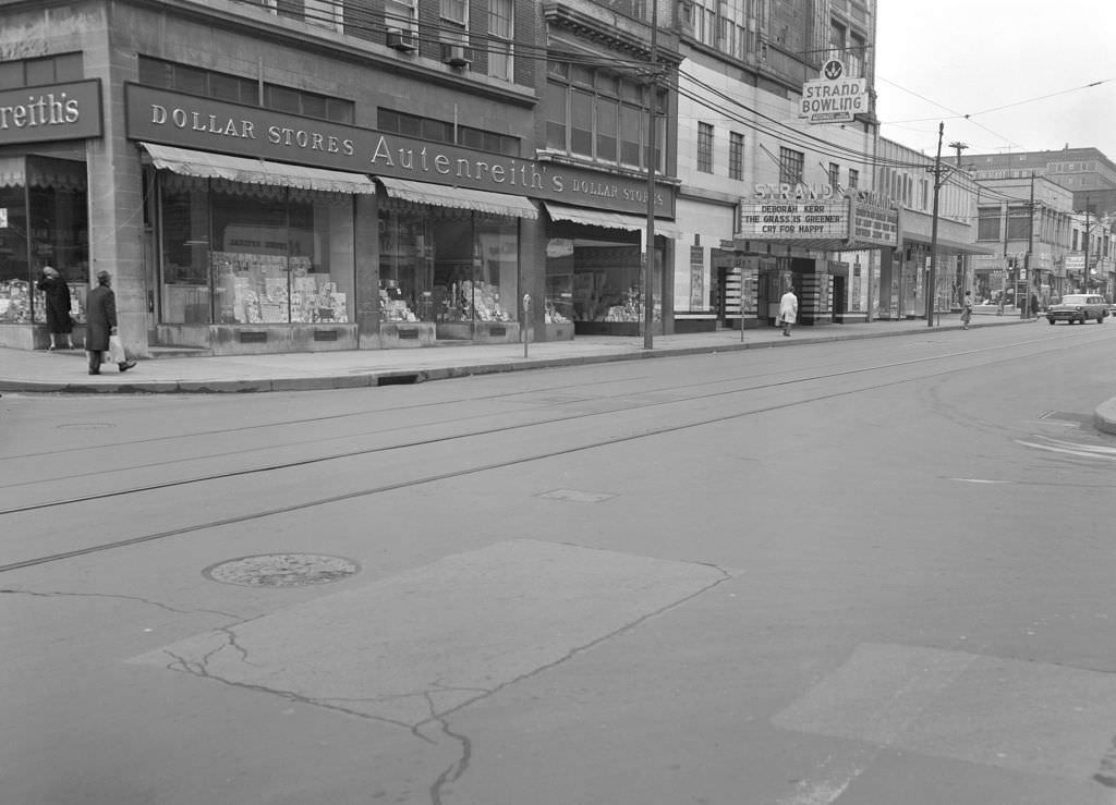#95 Eastward view on Forbes Avenue featuring Leonard’s Mens Shop, Marshall’s Restaurant, and The Strand Theatre, 1961.