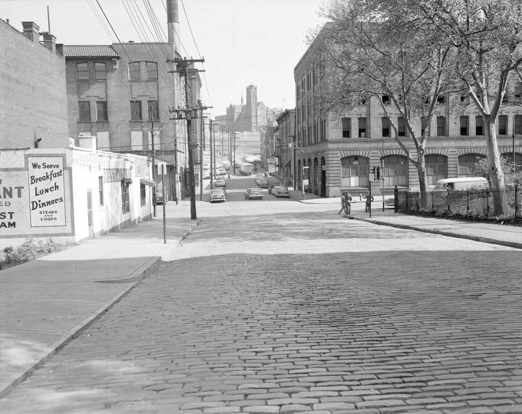 #121 Forbes at Stevenson Street, hillside church framed by buildings, 1960.