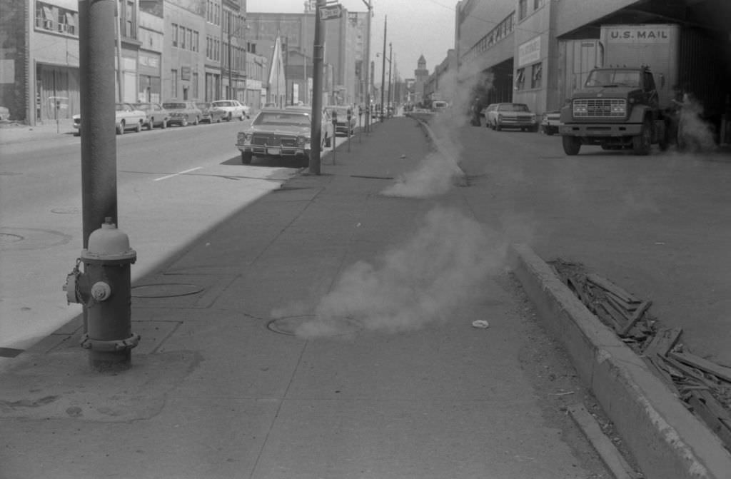 #120 Steam from manholes on Penn Avenue at 13th Street intersection, 1972.