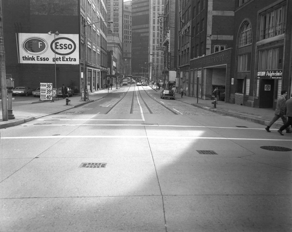 #81 7th Street featuring an Esso gas station and Century Building, 1970.