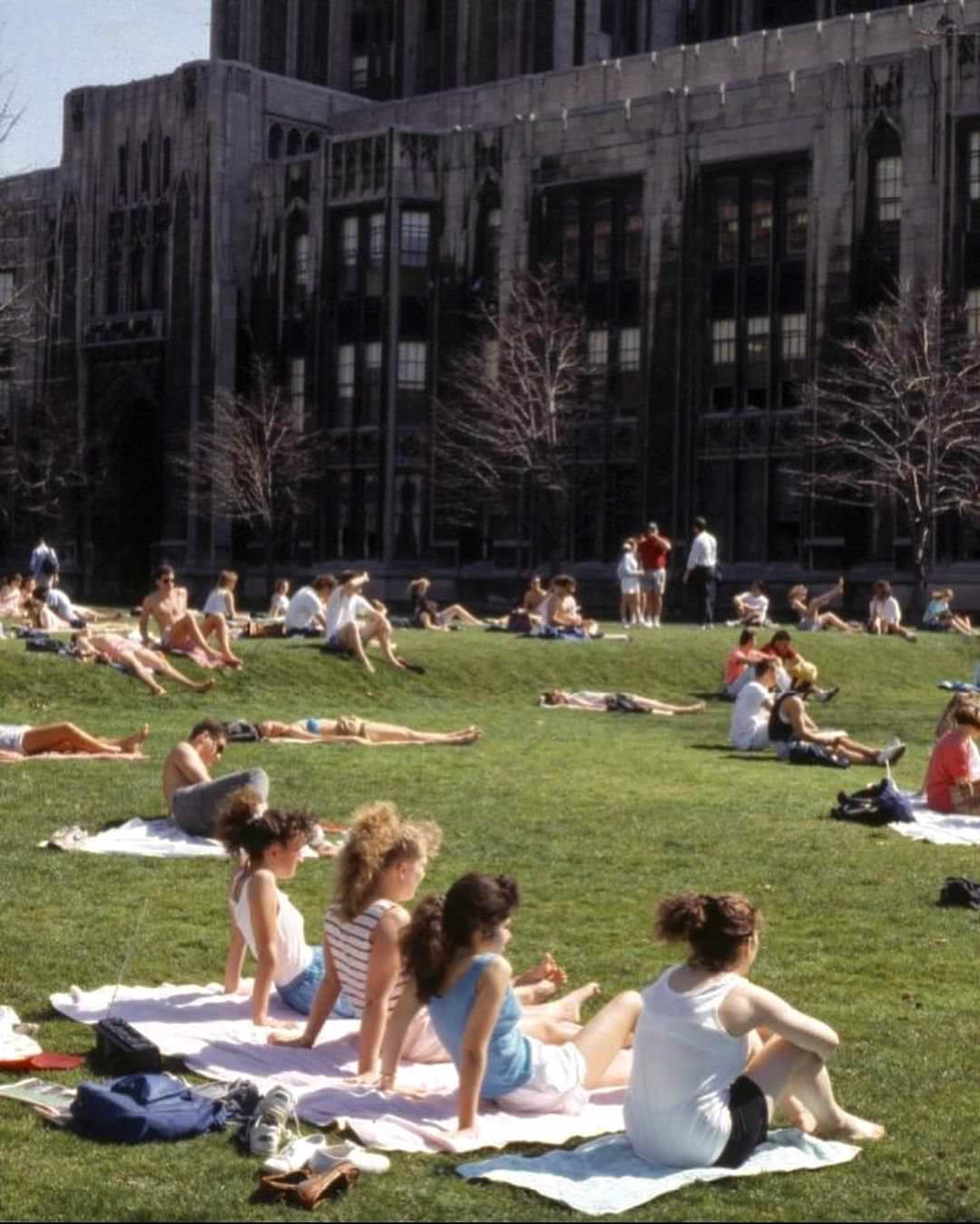 #5 Happy March! Students laying out on the Cathedral lawn around 1990.