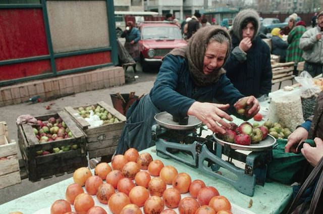 #46 Woman weighing apples, Ukraine, 1991