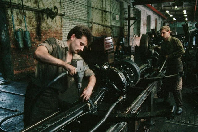 #48 Workers assemble axles at the Lviv Bus Plant (Lvivsky Avtobusny Zavod, or LAZ), Lviv, Ukraine, 1991