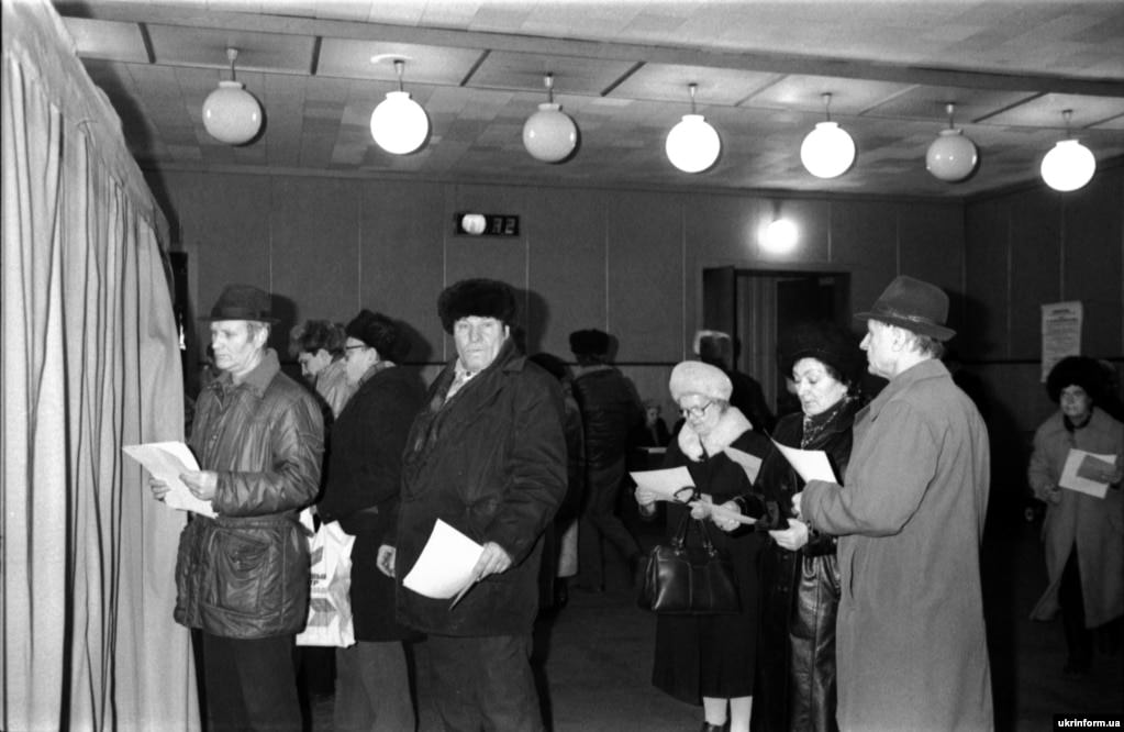 #16 Voters wait patiently to cast their ballots at the Kalinin mine in Donetsk, eastern Ukraine.