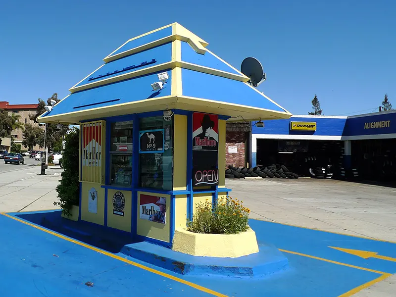 #2 A former Fotomat kiosk, repainted and now selling cigarettes.
