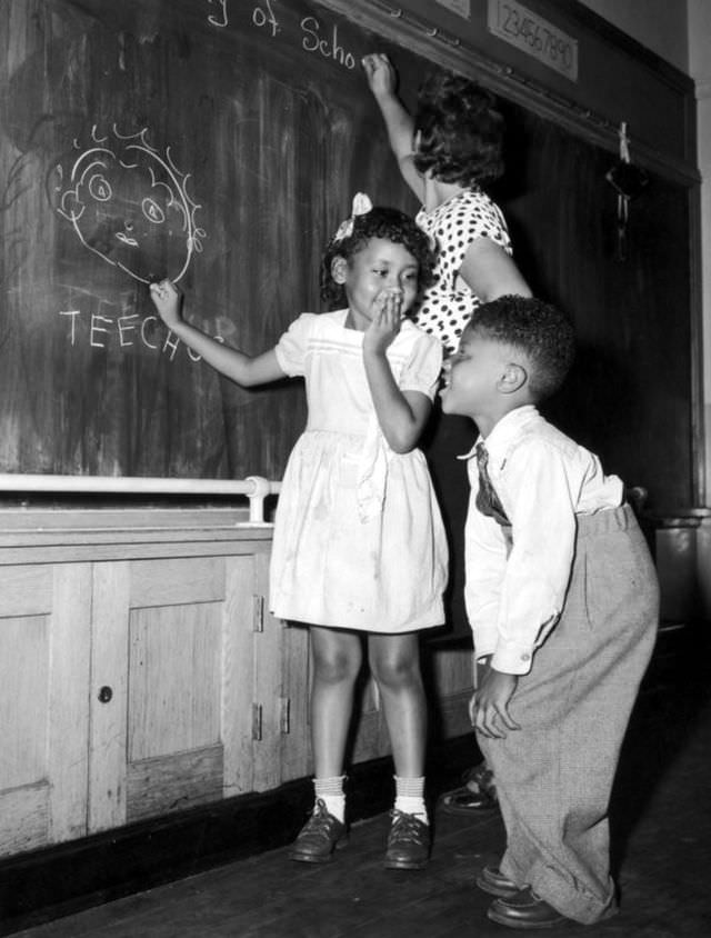 #14 Joyce Payne and Vincent Baker have fun depicting their teacher at a school in New York’s Harlem community on Sep. 13, 1948