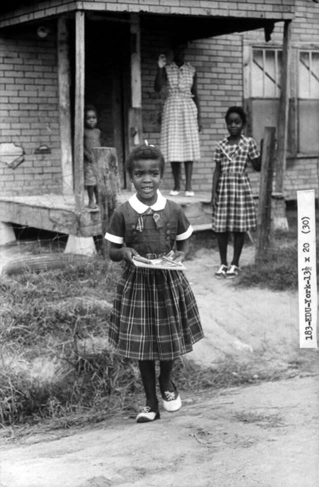 #23 Delores York heads off for her first day at a previously all-white school in September 1960 in Arkansas