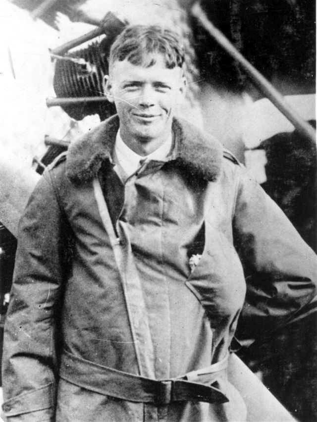 #4 Lindbergh poses with Spirit behind, circa 1927.