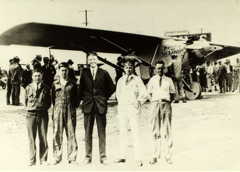 #7 Lindbergh and four workmen in front of Spirit.