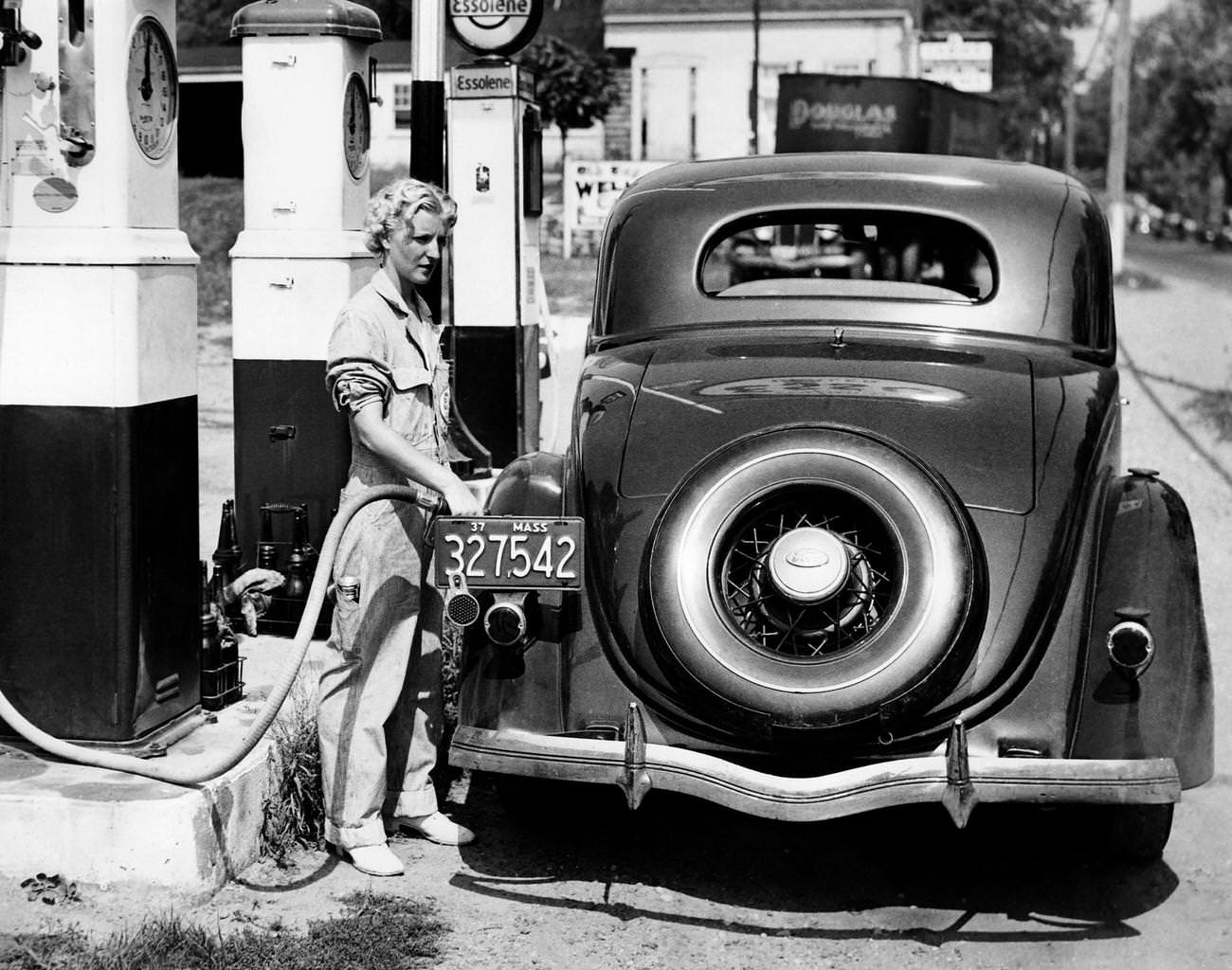 #11 Fuel pump employee fills a car in Danvers, Massachusetts, 1937.