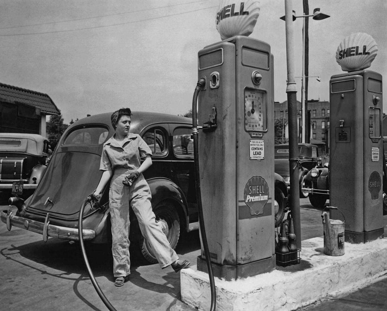 #15 Woman pumping gas at Shell station in New York during World War 2.