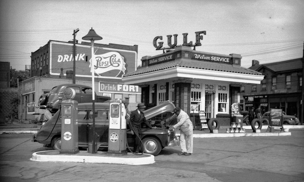 #22 Mechanic and observer at Wilson Gulf service station in Pittsburgh, Pennsylvania, 1946.