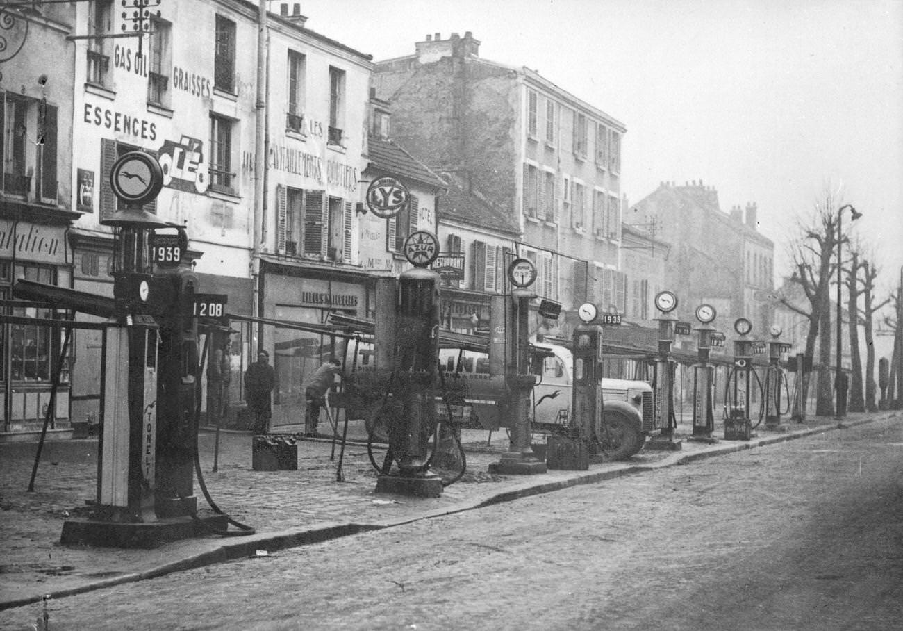 #23 Resupplying at a petrol station in Paris, 1947.