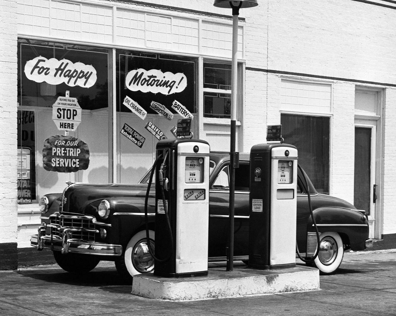 #29 Dodge car in a service station, 1950s.