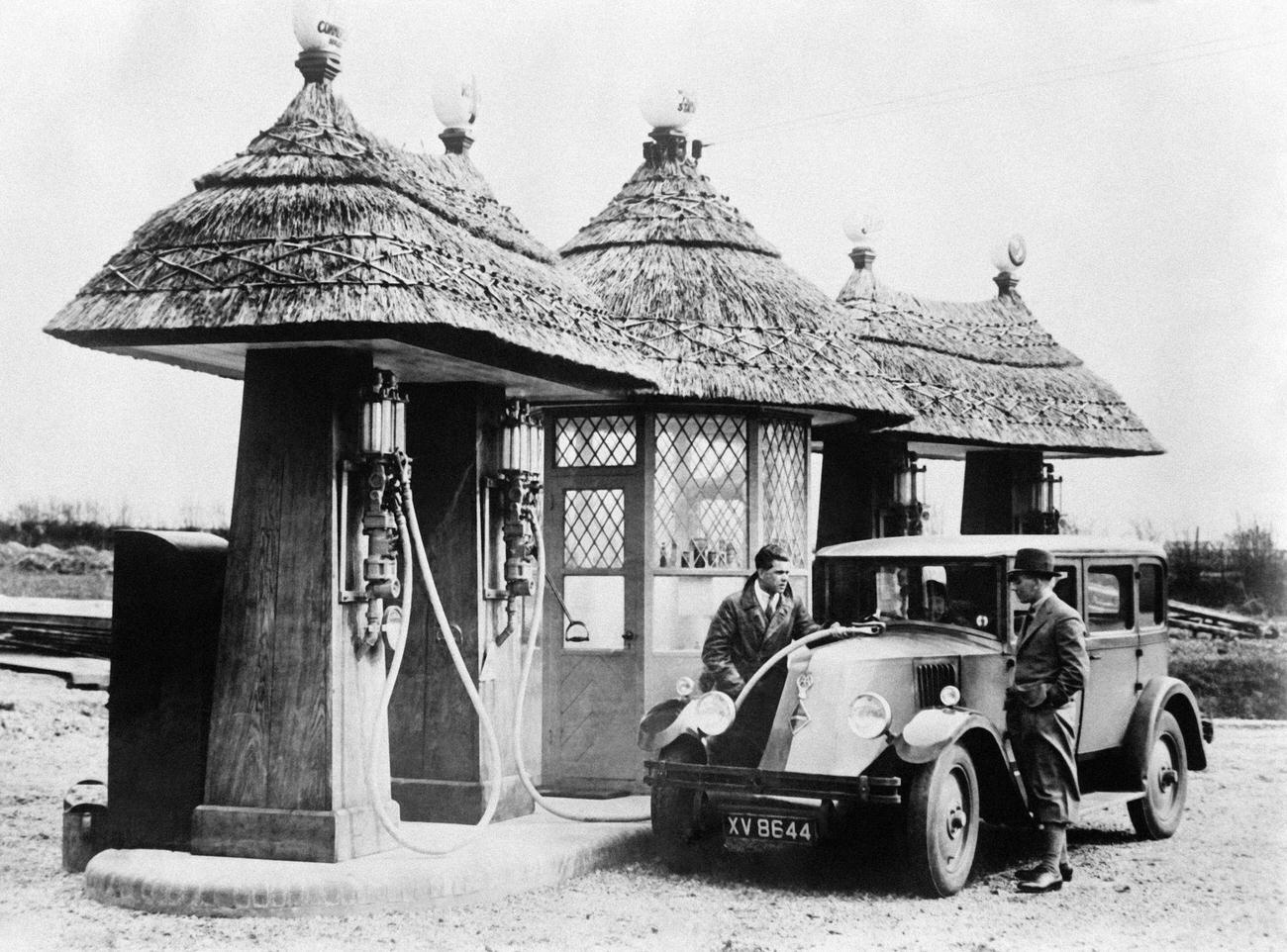 #4 New thatched-roof gas station in England, United Kingdom, 1930.