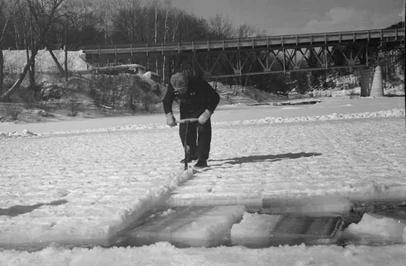 #33 A photograph that captures the ice cutting process on the Ottauquechee River in 1936.