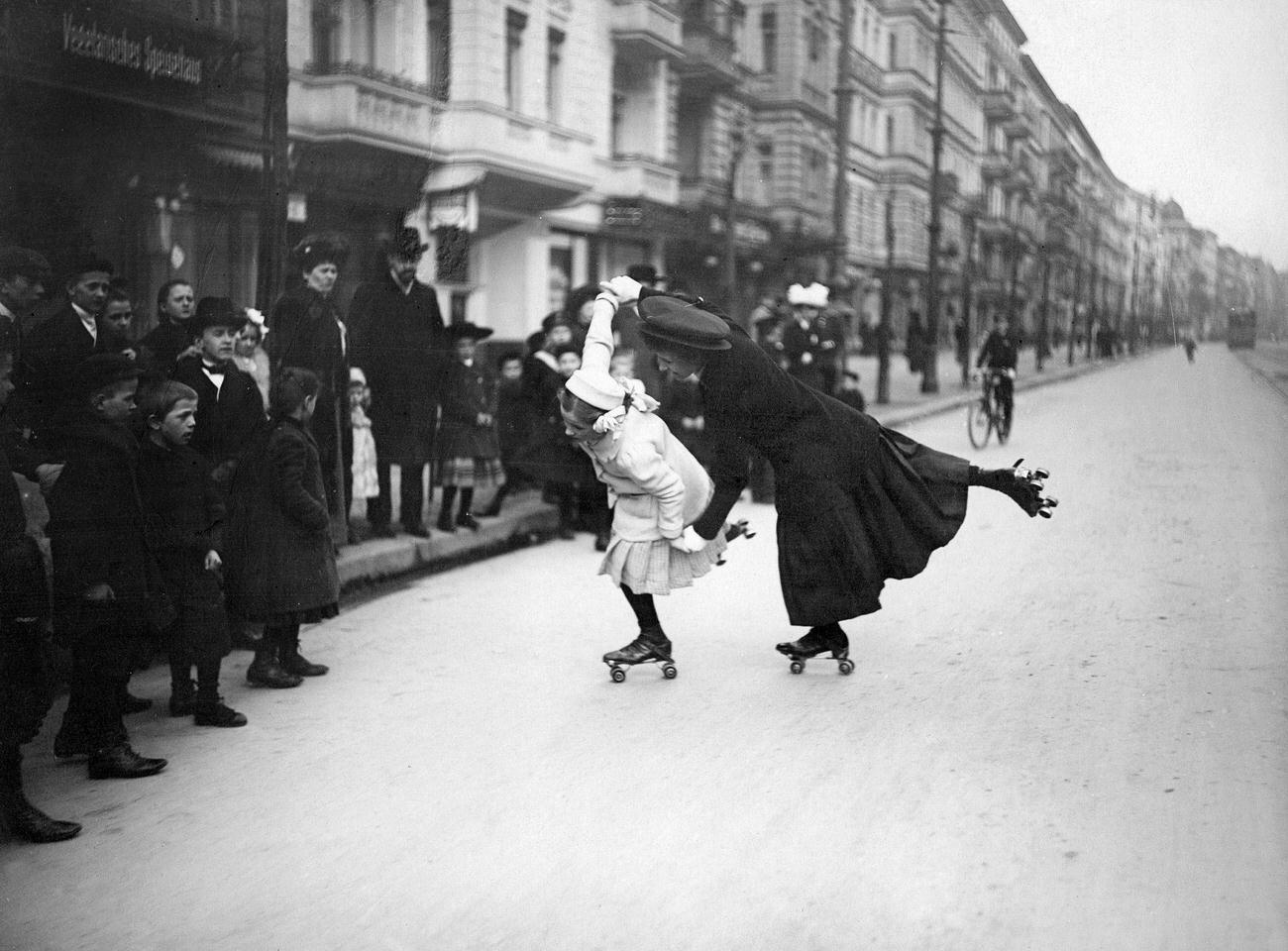 #1 A Woman and Girl Pair-Skating on Berlin Streets, 1910.