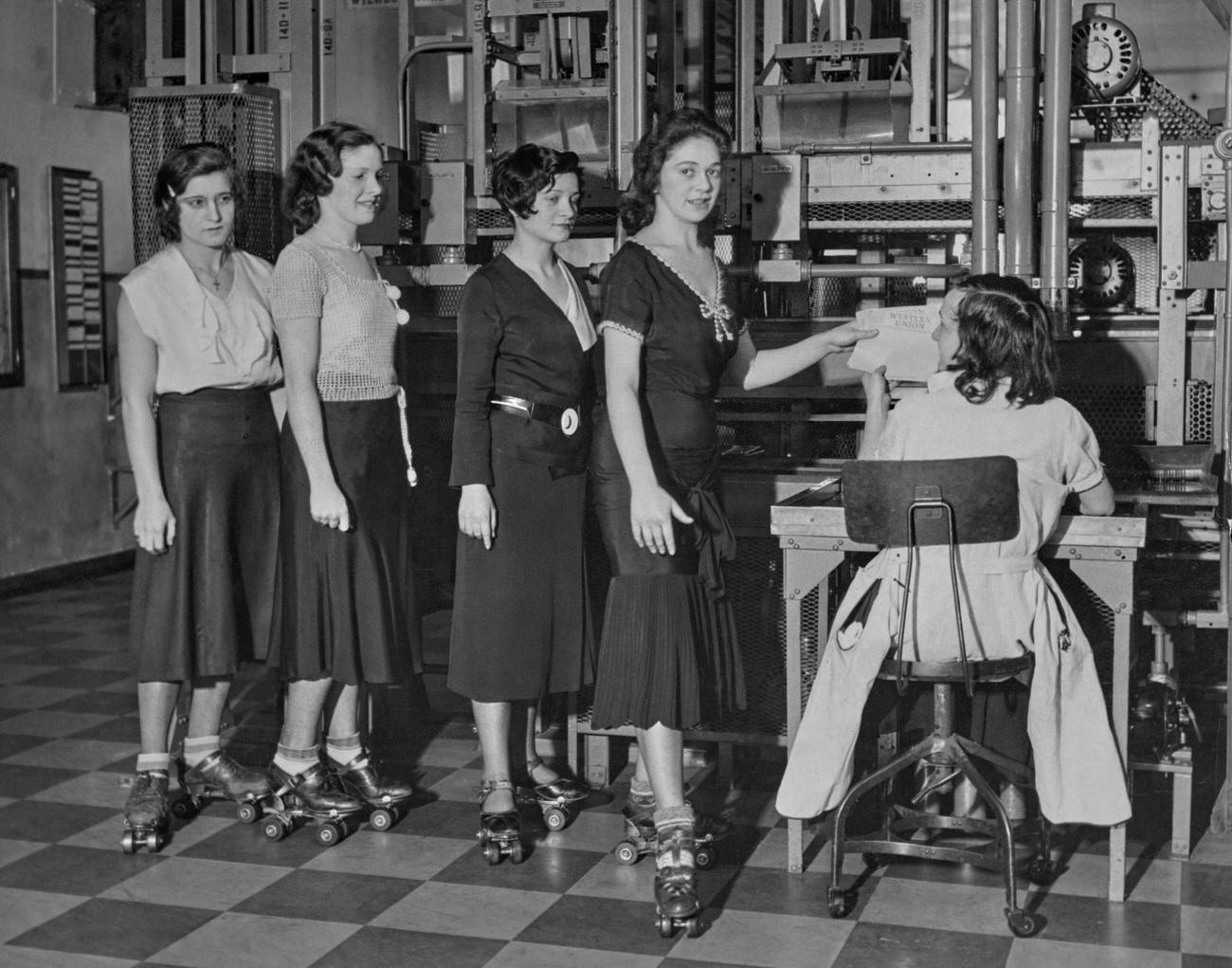 #16 Western Union Messengers on Roller Skates in New York, circa 1935.