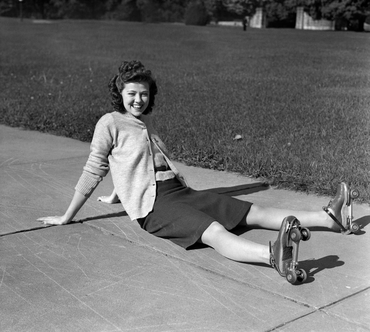 #25 Laughing Young Woman Sitting After a Fall, 1940s.