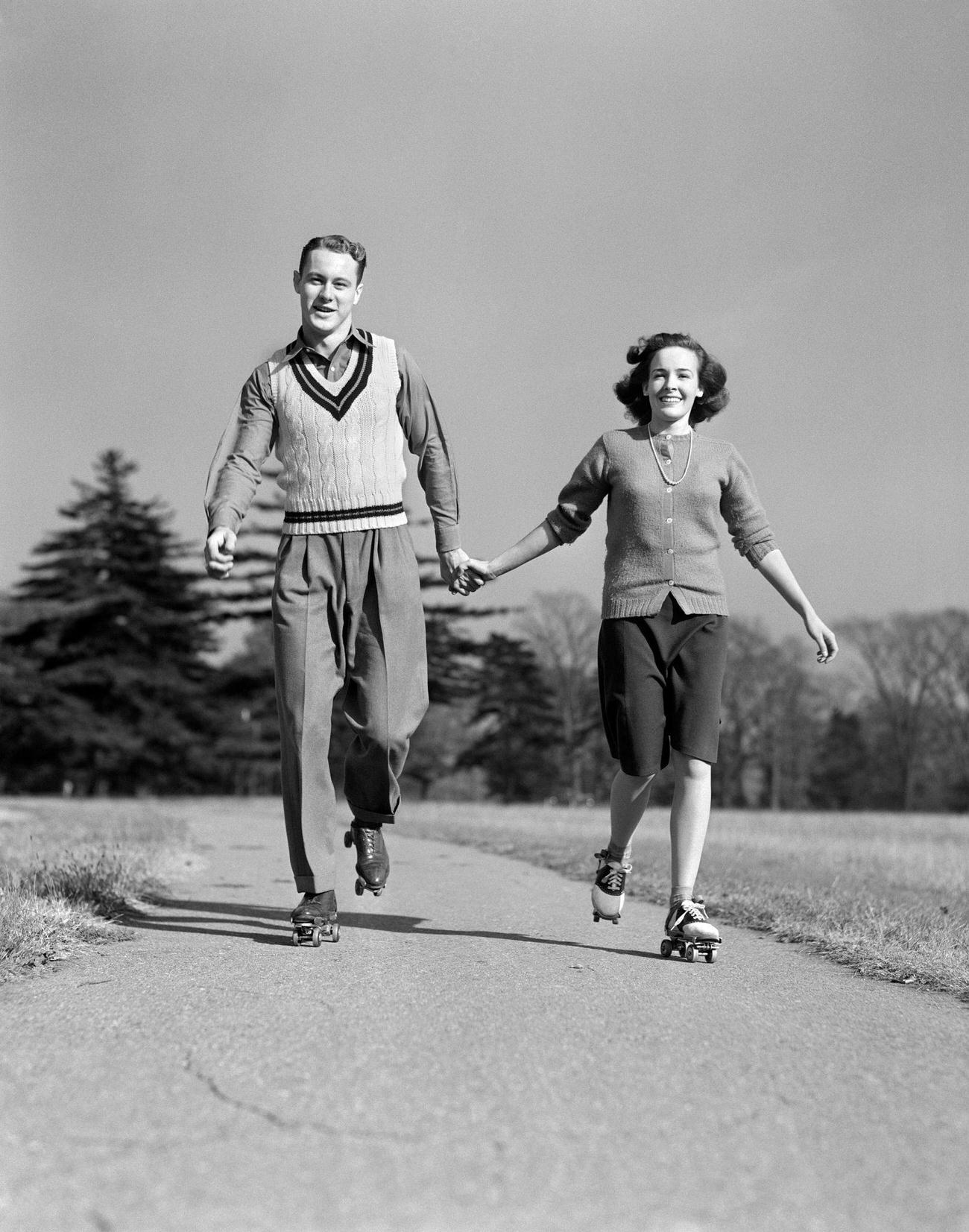 #27 Smiling Teenage Couple Roller Skating, 1940s.