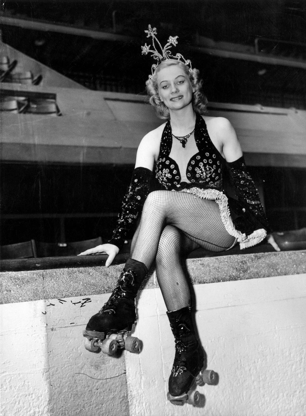 #34 Roller Skater Sitting at the Edge of the Rink, circa 1950.