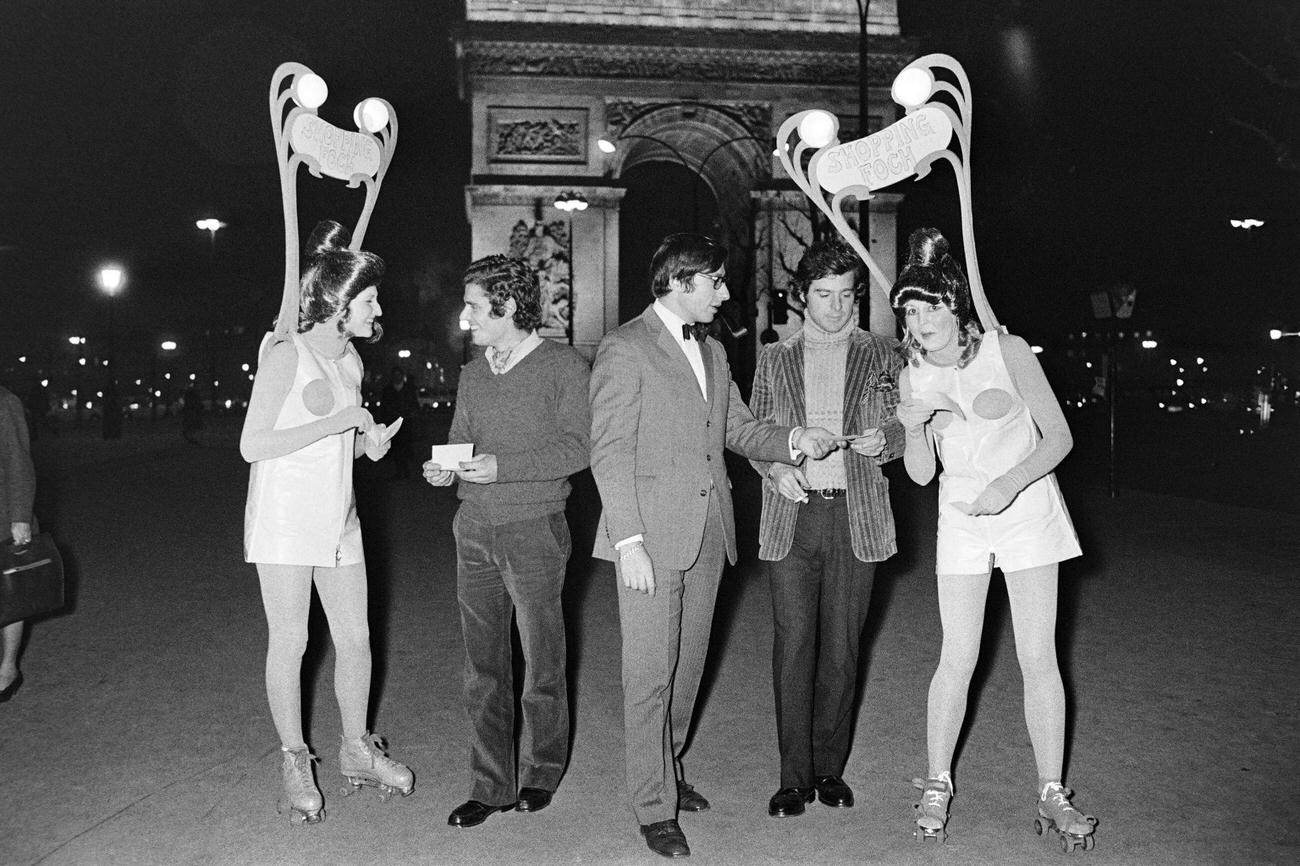 #64 “Sandwich Women” on Roller Skates Distribute Flyers in Paris, 1970