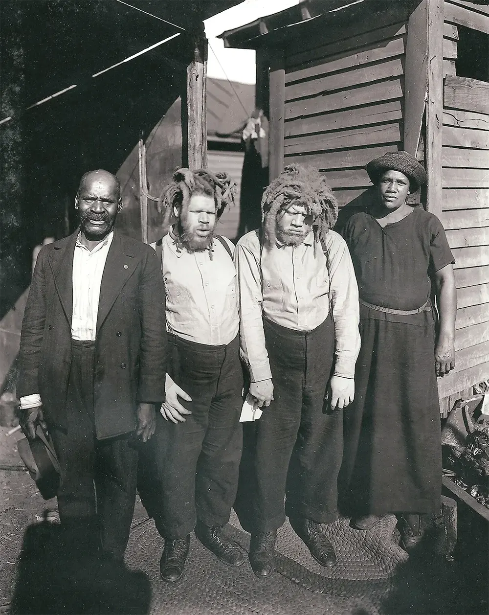 #8 Harriett Muse, right, and husband Cabell, far left, with the brothers shortly after she found them at a sideshow in 1927.