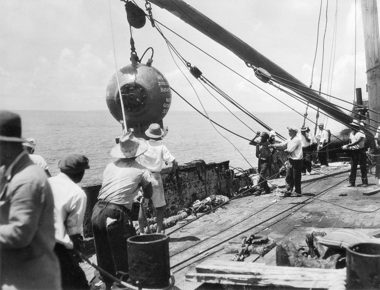 Dr. William Beebe and Otis Barton on barge during half-mile dive, Nonsuch Island.