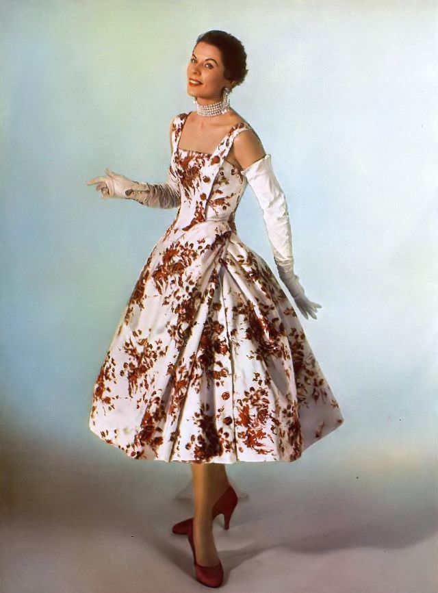 #18 Model in Madeleine de Rauch’s floral silk dress, 1955.