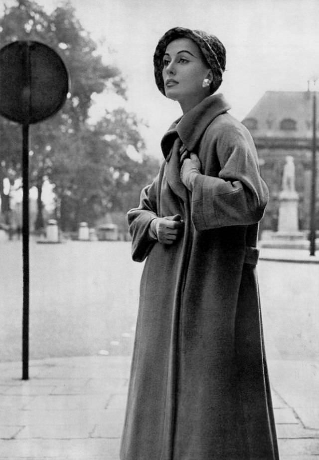 #24 Marina in Madeleine de Rauch’s camel-hair coat, 1957.