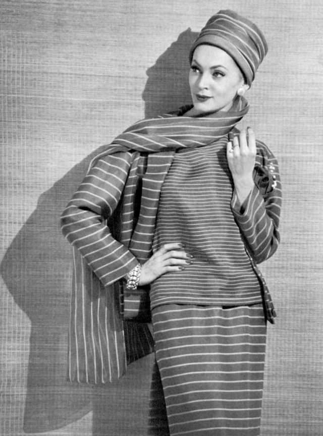 #29 Ghislaine Arsac in Madeleine de Rauch’s striped organdy ensemble, 1958.