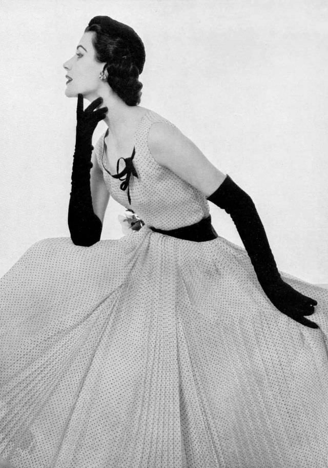 #8 Myrtle Crawford in Madeleine de Rauch’s pleated, white muslin dress, 1953.